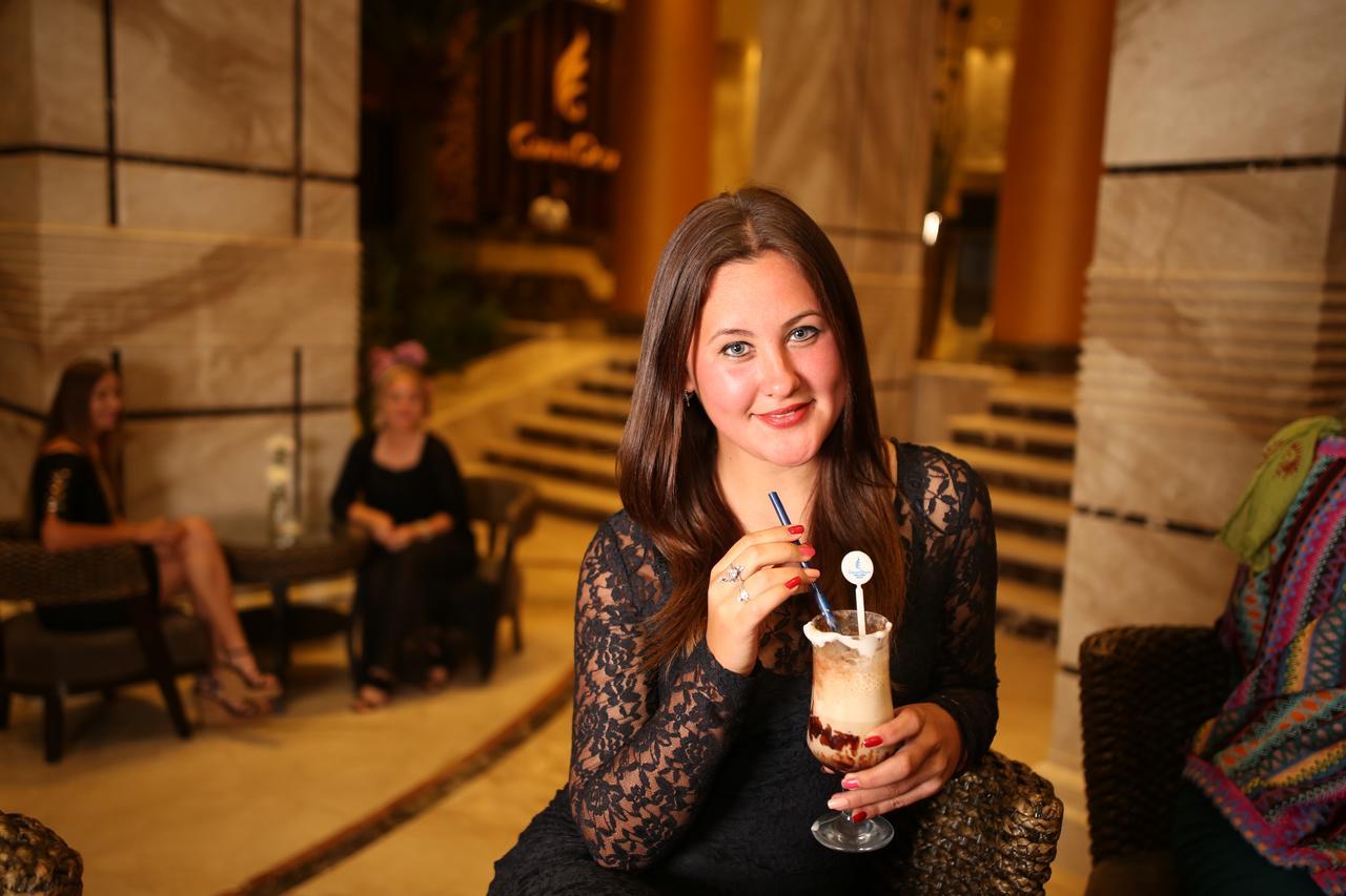 Grand Ocean El Sokhna Hotel Ain Sukhna Exterior photo A woman drinking a coffee cocktail